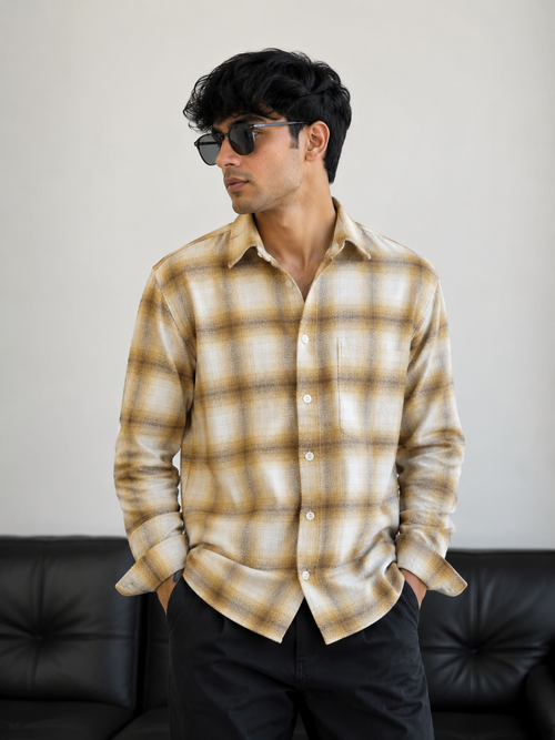 Model wearing beige and cream check shirt