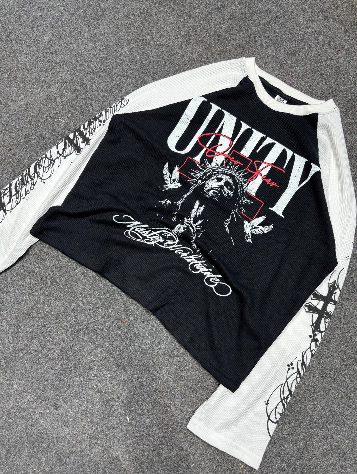 Black and white full-sleeve graphic tee front view